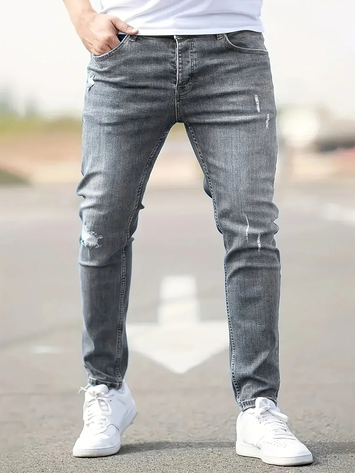 Men's Slim Fit Tapered Leg Distressed Denim Jeans with Ripped Knee Detail and Faded Wash